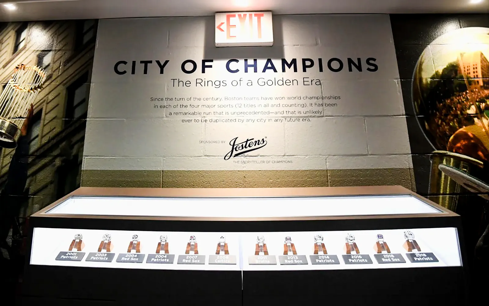 Exhibit of championship rings at The Sports Museum, Boston, showcasing Boston teams' victories.