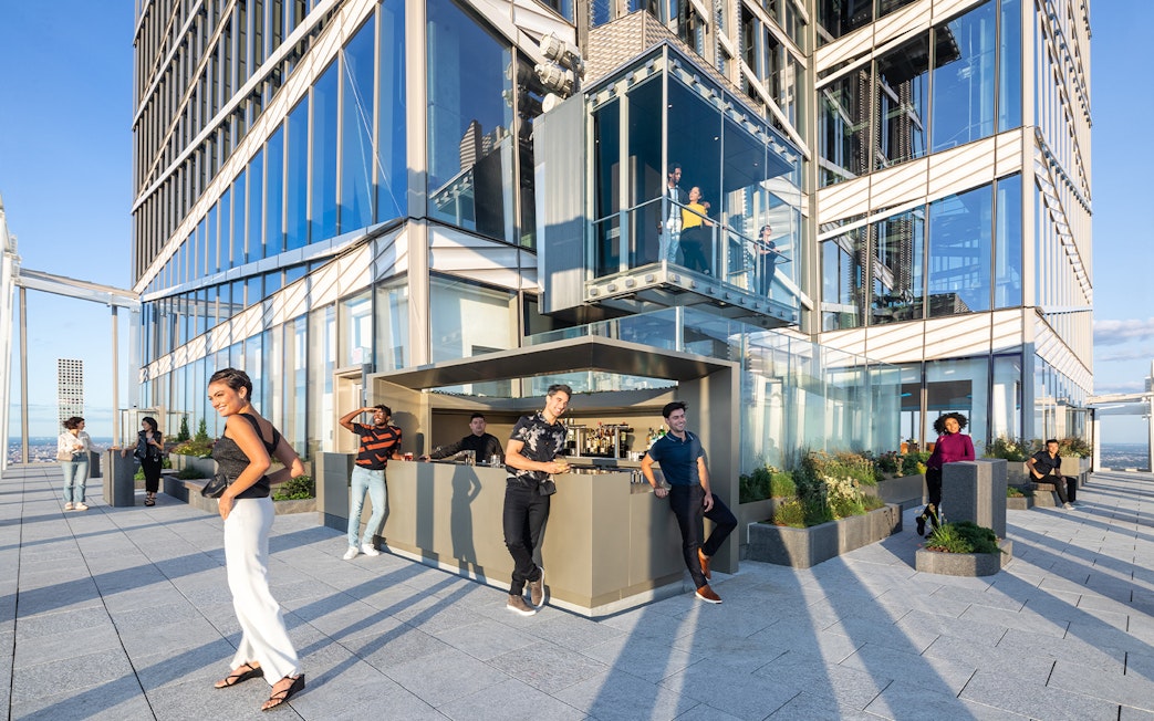 People enjoying drinks at Après Terrace Bar, Summit One Vanderbilt, New York.
