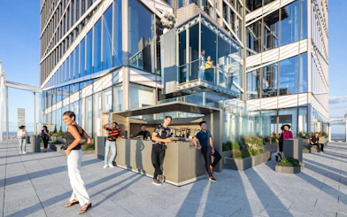 People enjoying drinks at Après Terrace Bar, Summit One Vanderbilt, New York.