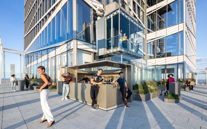 People enjoying drinks at Après Terrace Bar, Summit One Vanderbilt, New York.
