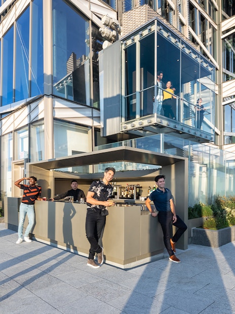 People enjoying drinks at Après Terrace Bar, Summit One Vanderbilt, New York.