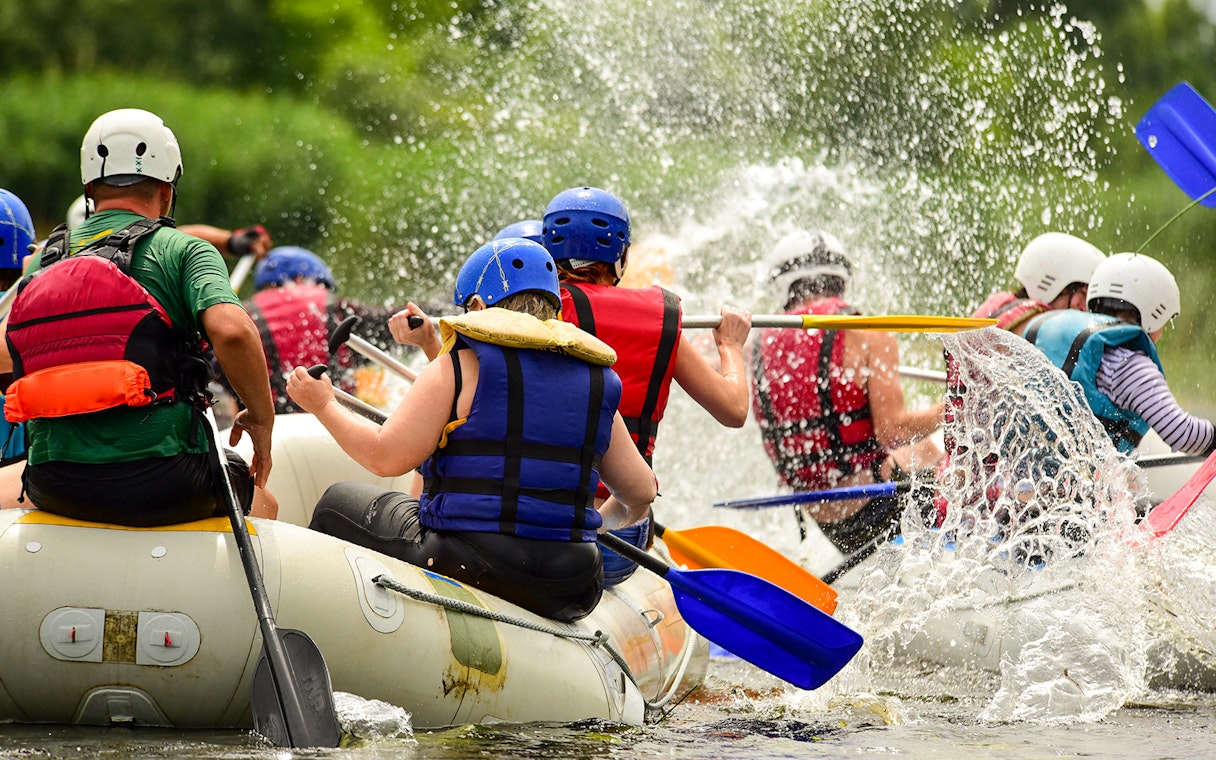 River rafting group navigating rapids in Antalya.