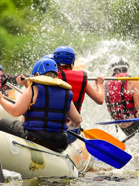 River rafting group navigating rapids in Antalya.