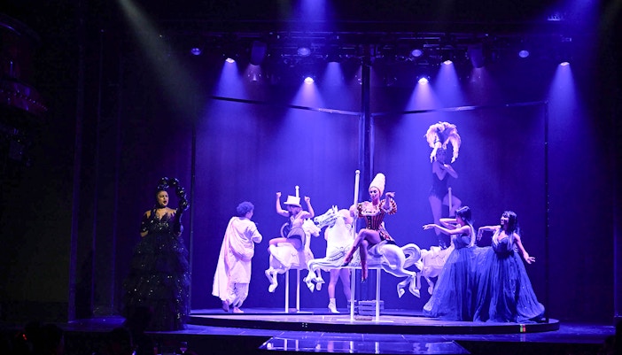 Cabaret dance performers on stage in Paris