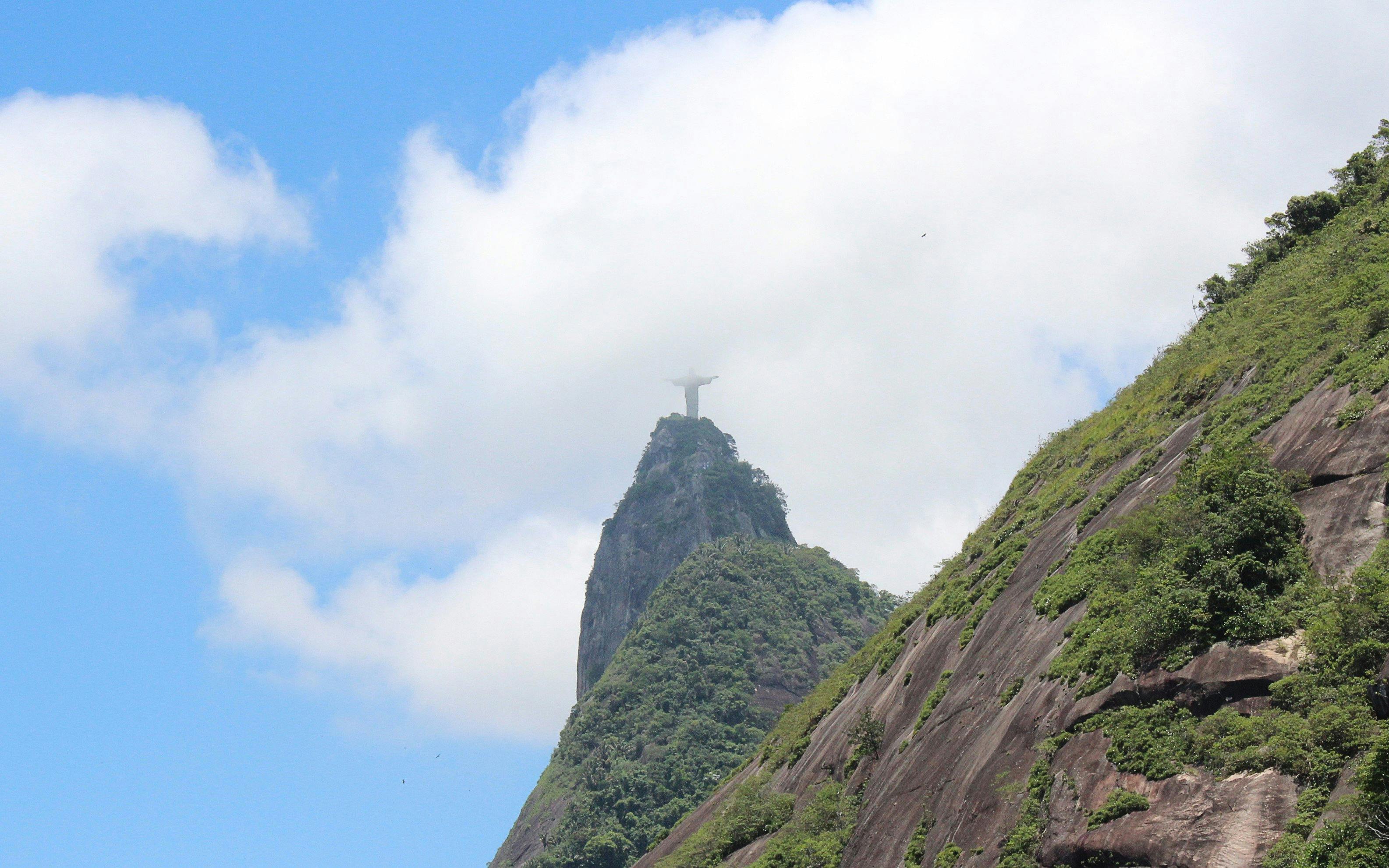 Christ the Redeemer statue atop Corcovado Mountain viewed from Favela Santa Marta, Rio de Janeiro.
