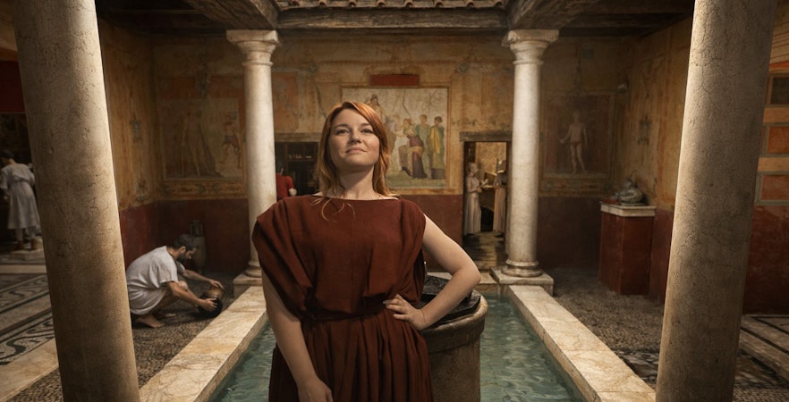 Ancient Roman bath scene with people in period clothing, part of Setas de Sevilla tour.