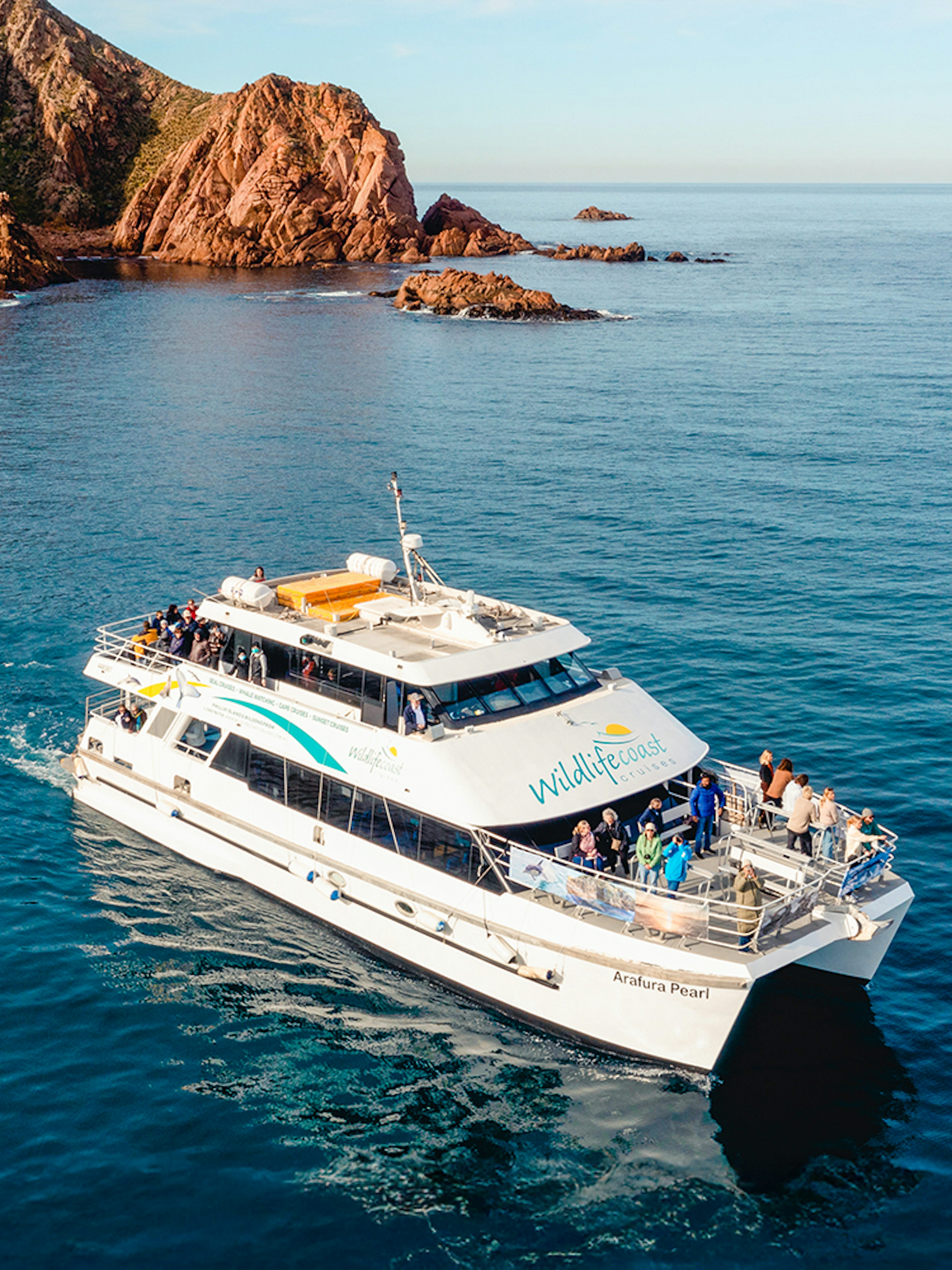 Cruise boat near Cape Woolamai, Phillip Island, with passengers enjoying Wildlife Coast Cruises.