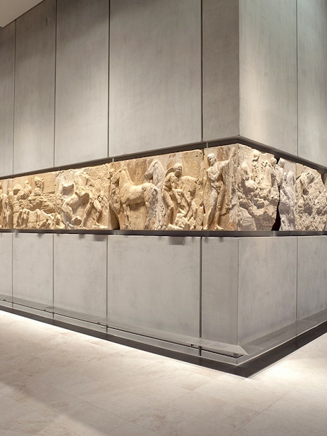 Acropolis Museum frieze display in Athens, Greece, showcasing ancient Greek sculptures.
