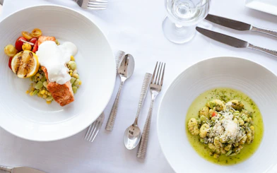 Salmon with vegetables and gnocchi served on Marina del Rey Premier Dinner Cruise.