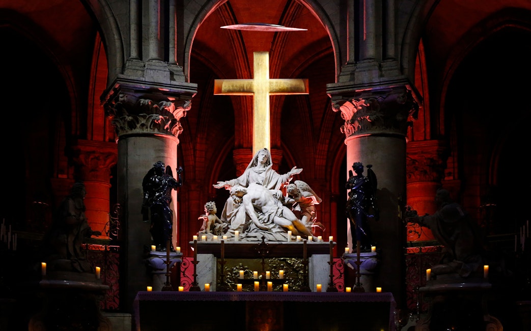 Pietà sculpture illuminated inside Notre Dame Cathedral, Paris.