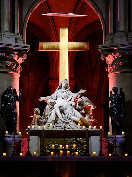 Pietà sculpture illuminated inside Notre Dame Cathedral, Paris.