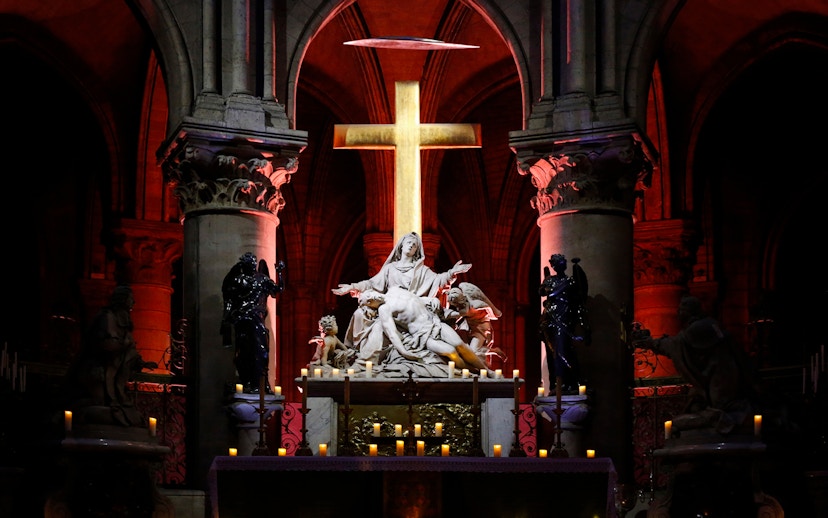 Pietà sculpture illuminated inside Notre Dame Cathedral, Paris.