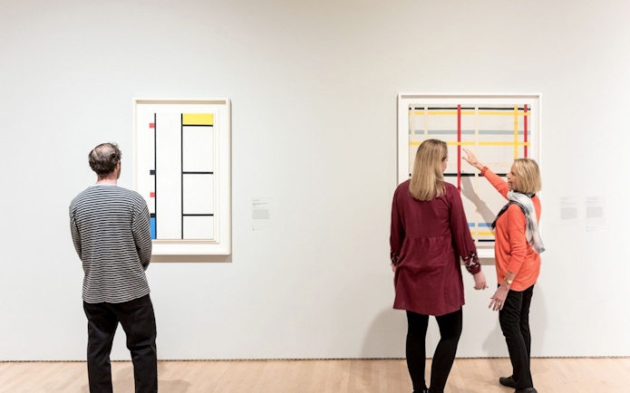 Visitors viewing abstract art at San Francisco Museum of Modern Art.