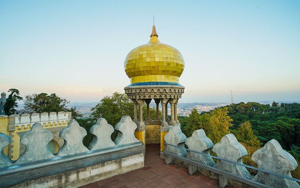 Pena Palace's yellow dome with scenic view of Sintra, Portugal.