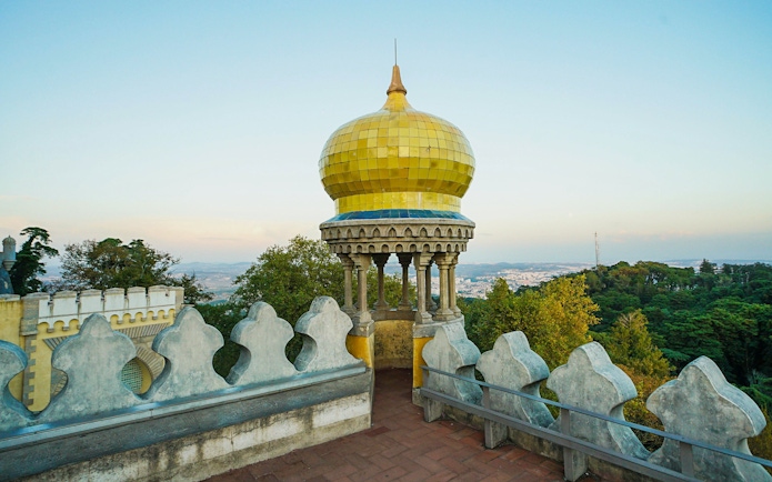 Pena Palace's yellow dome with scenic view of Sintra, Portugal.