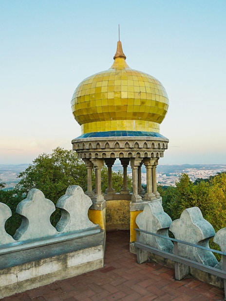 Pena Palace's yellow dome with scenic view of Sintra, Portugal.