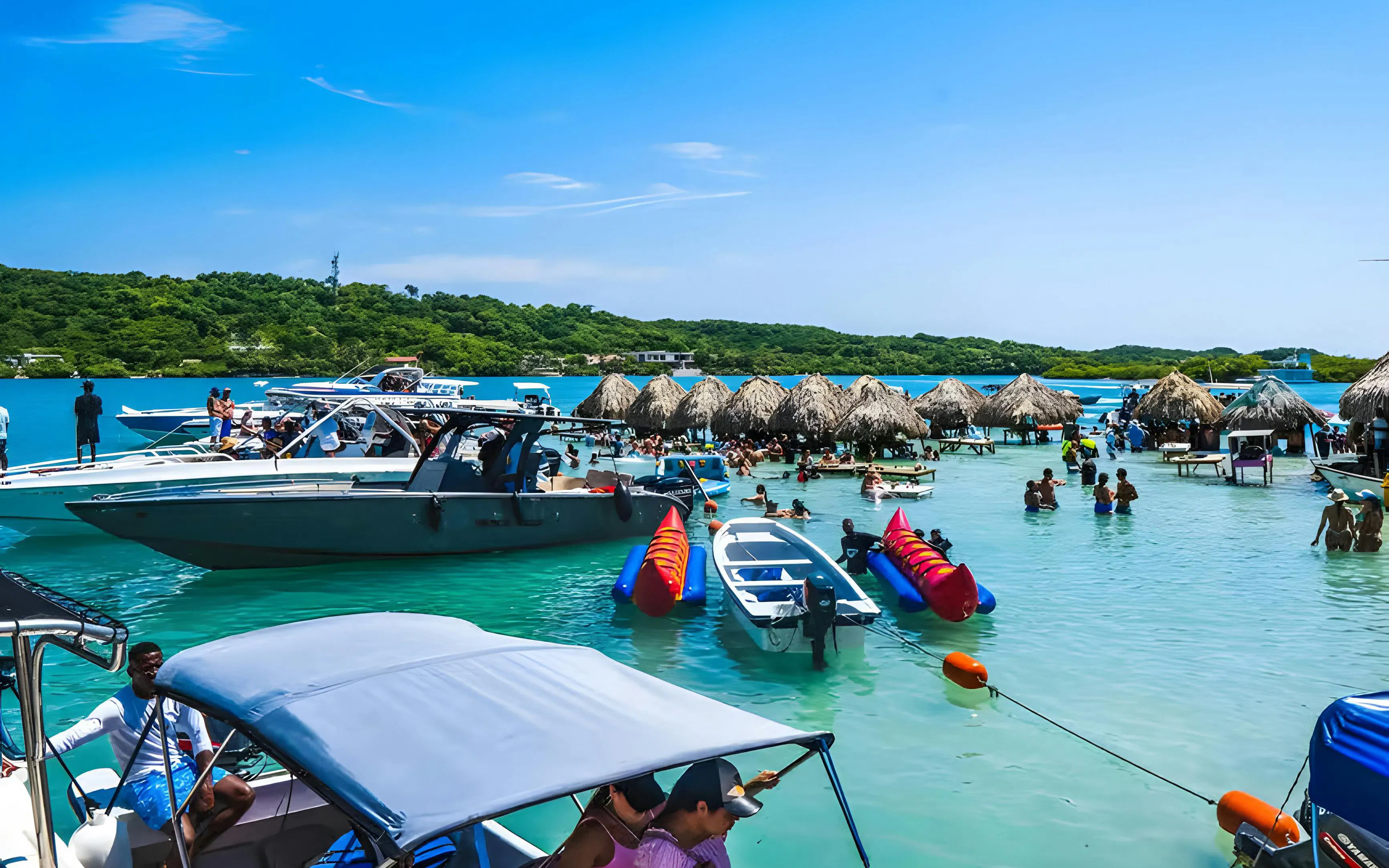 Tourists enjoying boats and water activities at Rosario Islands, Cartagena, Colombia.