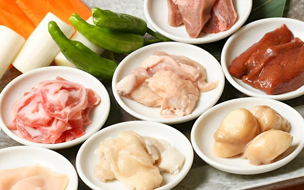 Assorted raw meats and vegetables for Nikusen Tonya full course meal with Wagyu beef.