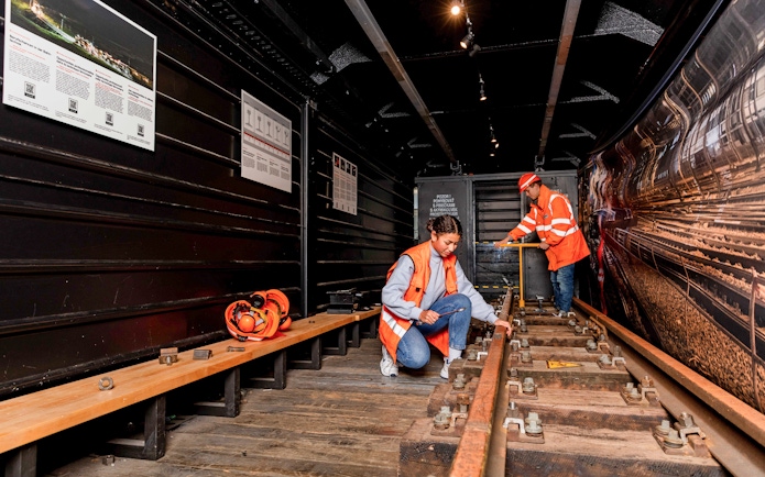 Workers inspecting railway tracks at Swiss Museum of Transport, Lucerne.