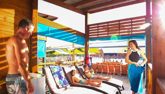 A family at Dreamworld lounging