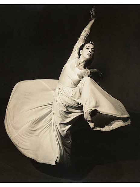 Dancer in flowing dress captured mid-movement, featured in Women Photographers (1900-1975) at National Gallery of Victoria.