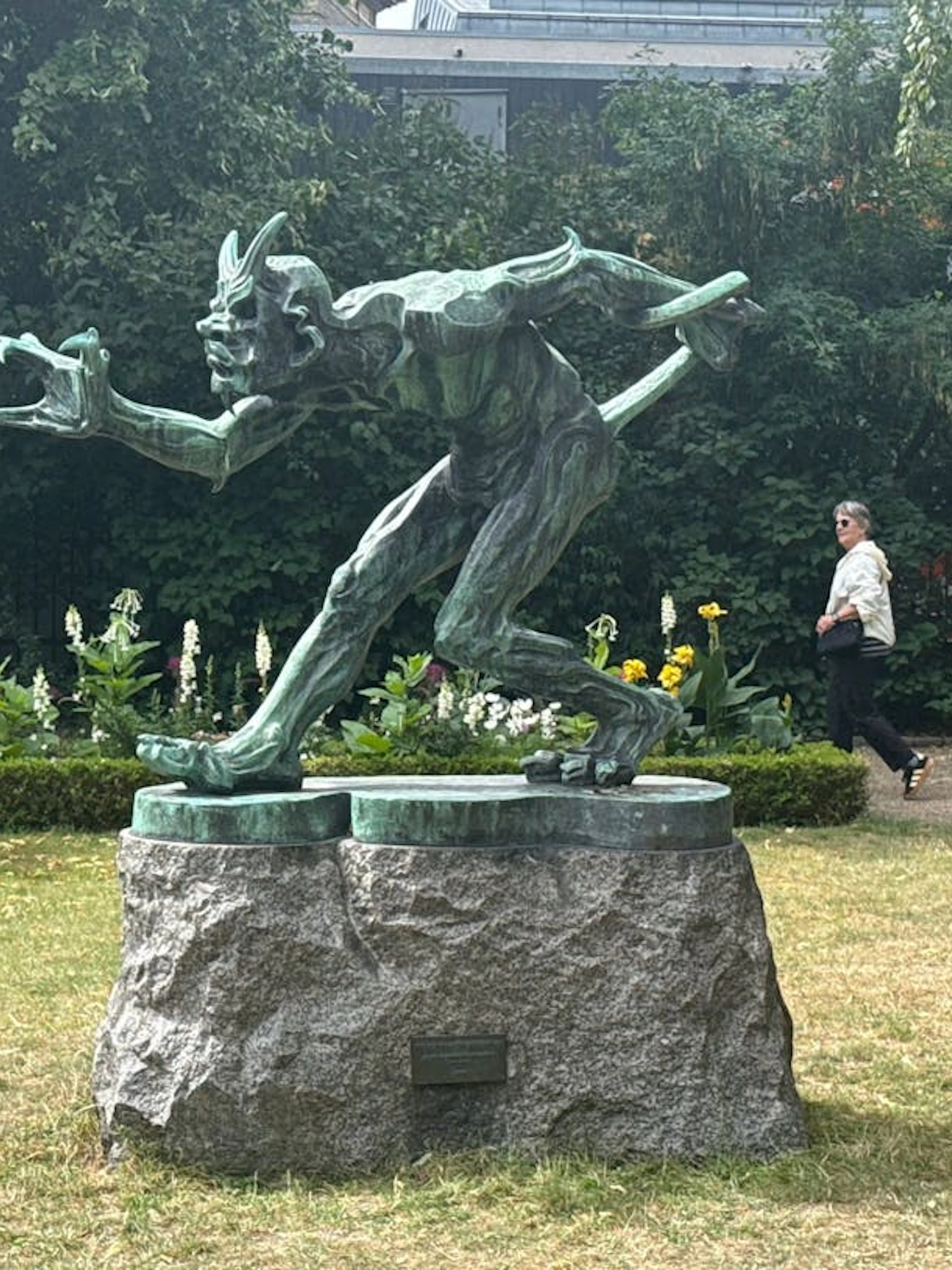 Statue of a mythical creature in a Copenhagen park, part of Andersen's city exploration game.