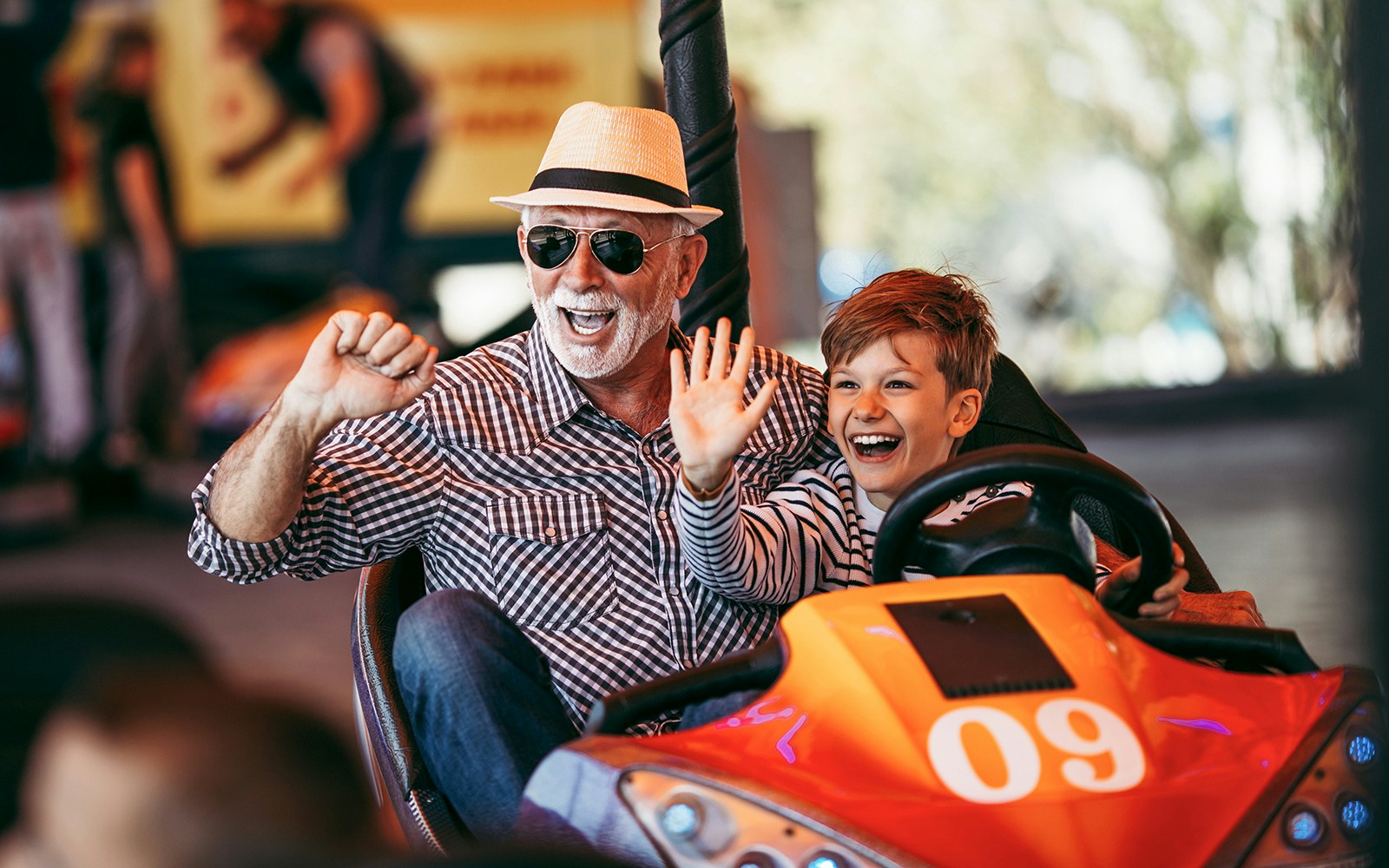 Bumper cars at an amusement park in Vienna, Austria, with people enjoying the ride.