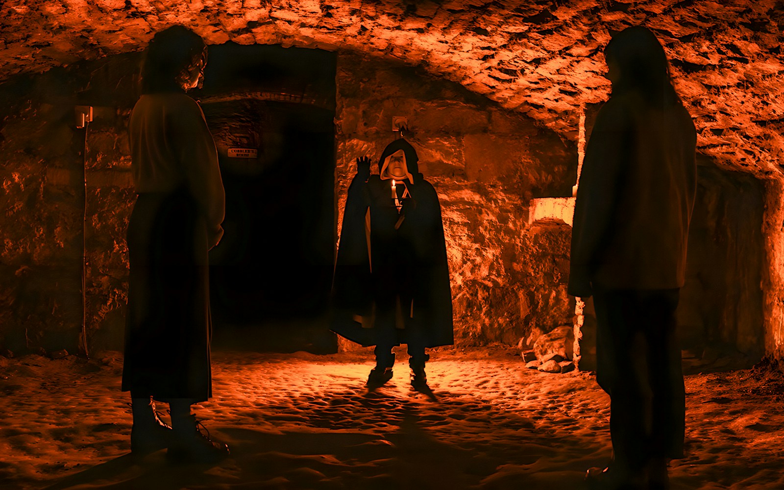 Edinburgh night tour group in underground vaults with guide.