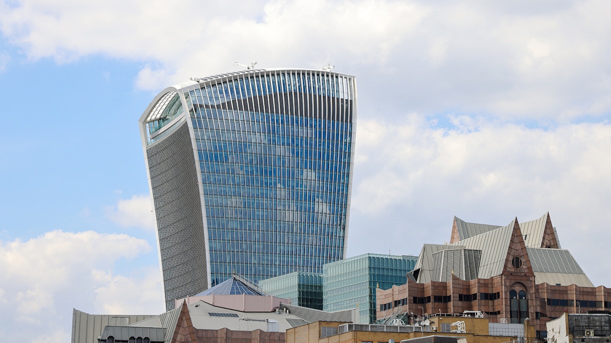 Walkie Talkie building in London, home to Sky Garden, against a cloudy sky.