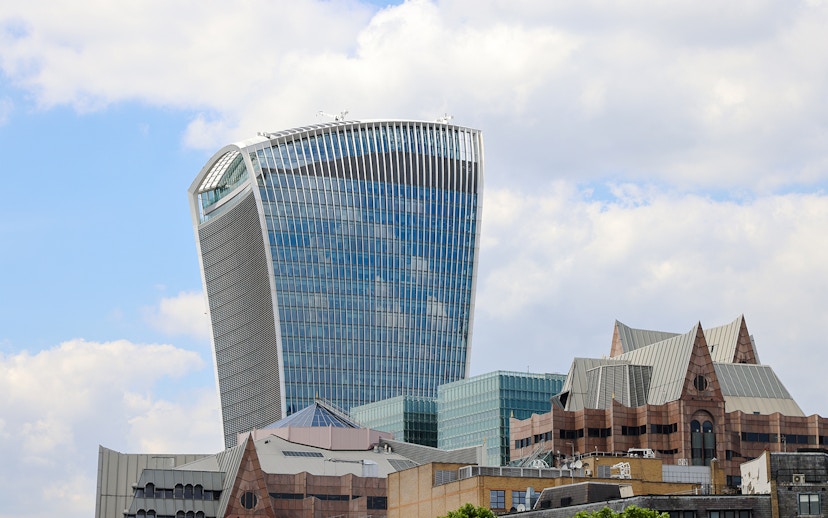 Walkie Talkie building in London, home to Sky Garden, against a cloudy sky.
