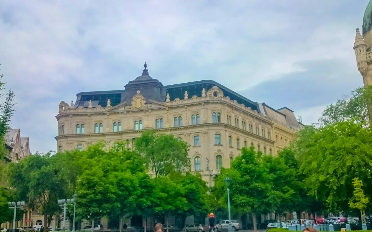 Historic building facade in Budapest, part of the Golden Age Sweet Tastes city exploration game.