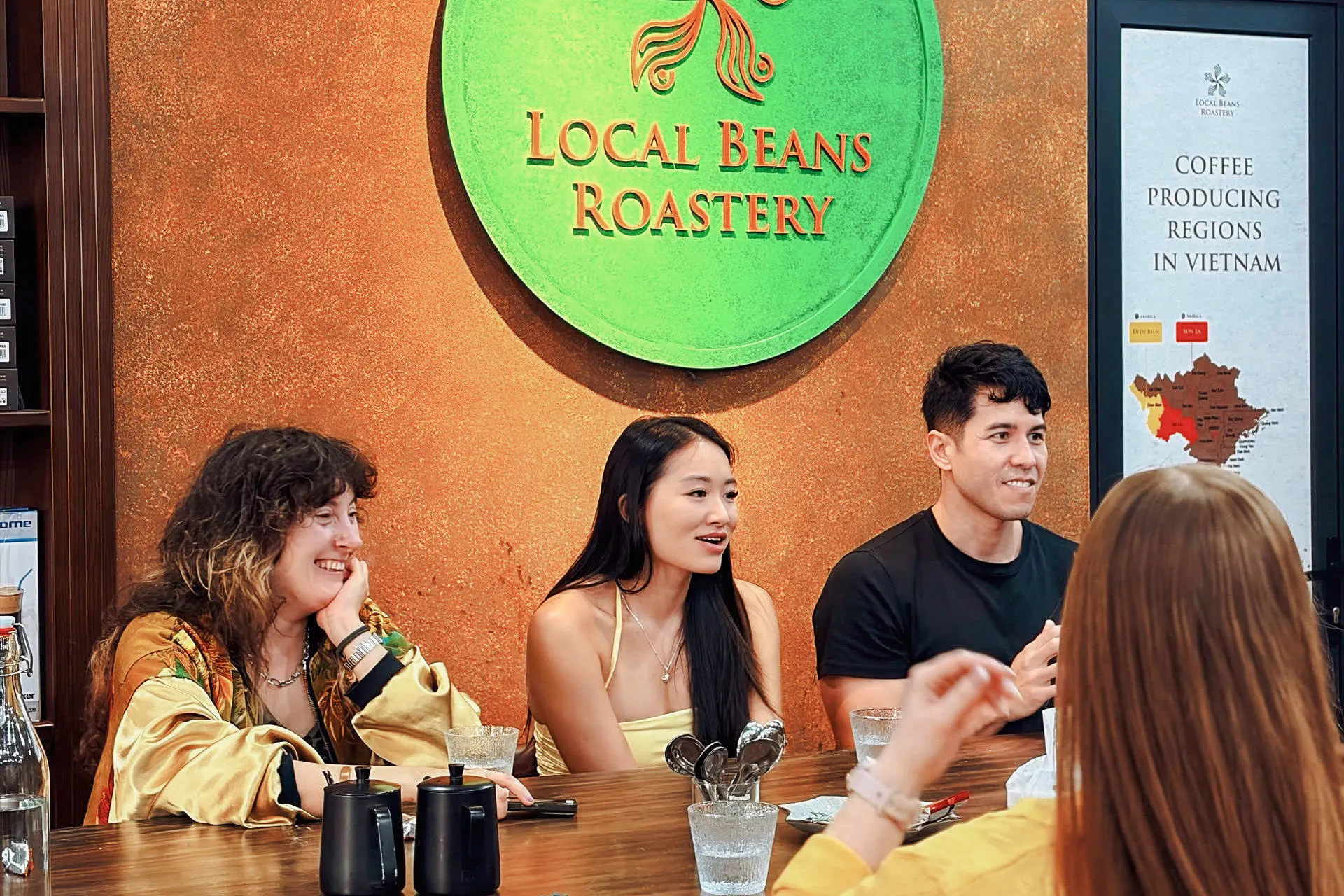 Group enjoying coffee tasting at Local Beans Roastery, Hanoi.