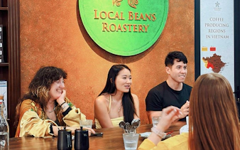 Group enjoying coffee tasting at Local Beans Roastery, Hanoi.