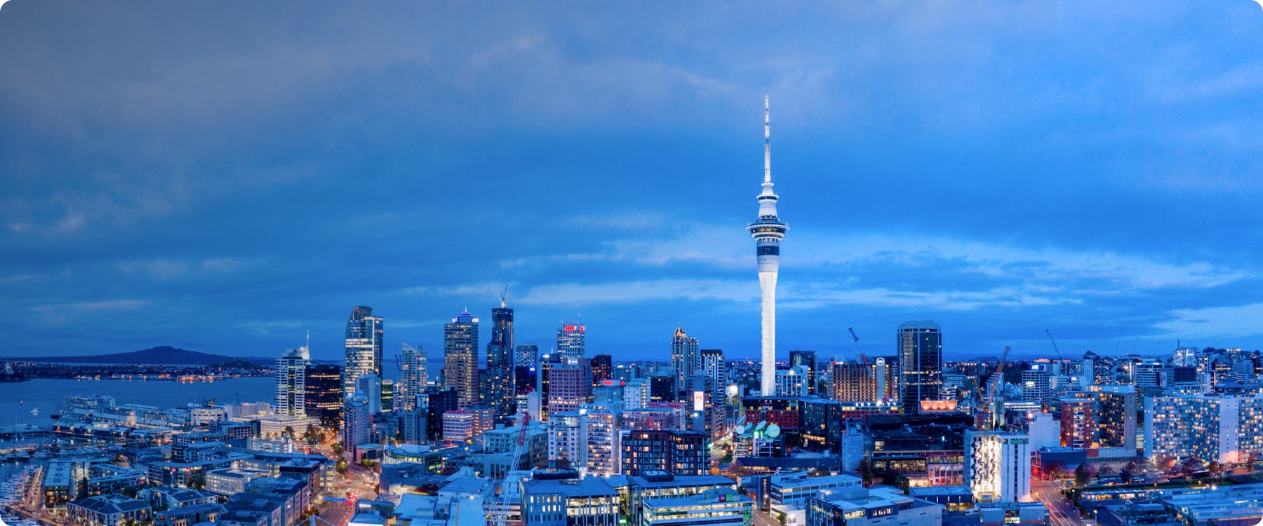 Auckland skyline with Sky Tower at dusk.