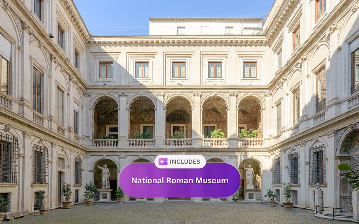 National Roman Museum courtyard with classical statues and arches.