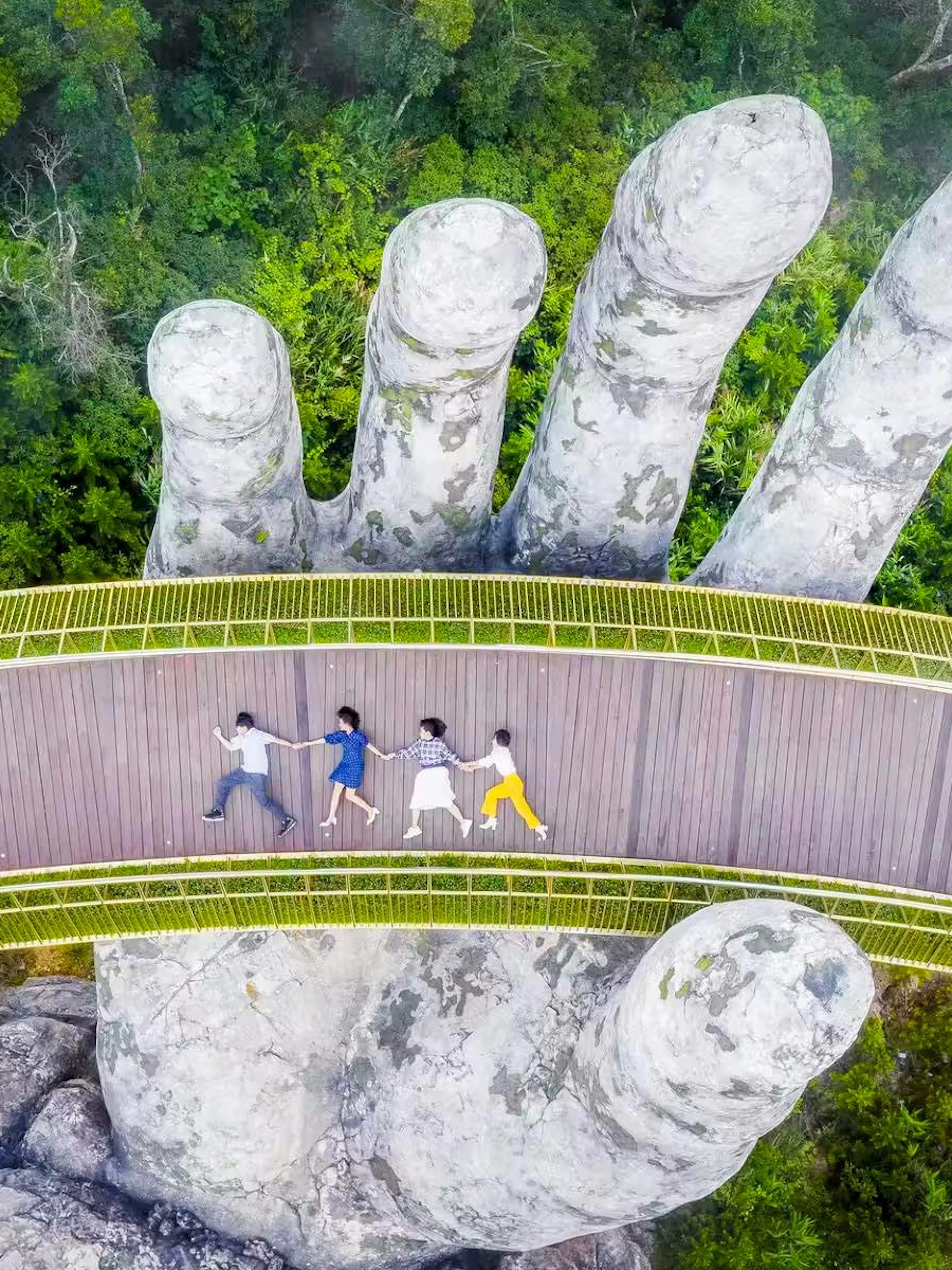 Golden Bridge in Sun World Ba Na Hills, Da Nang, with giant stone hands.