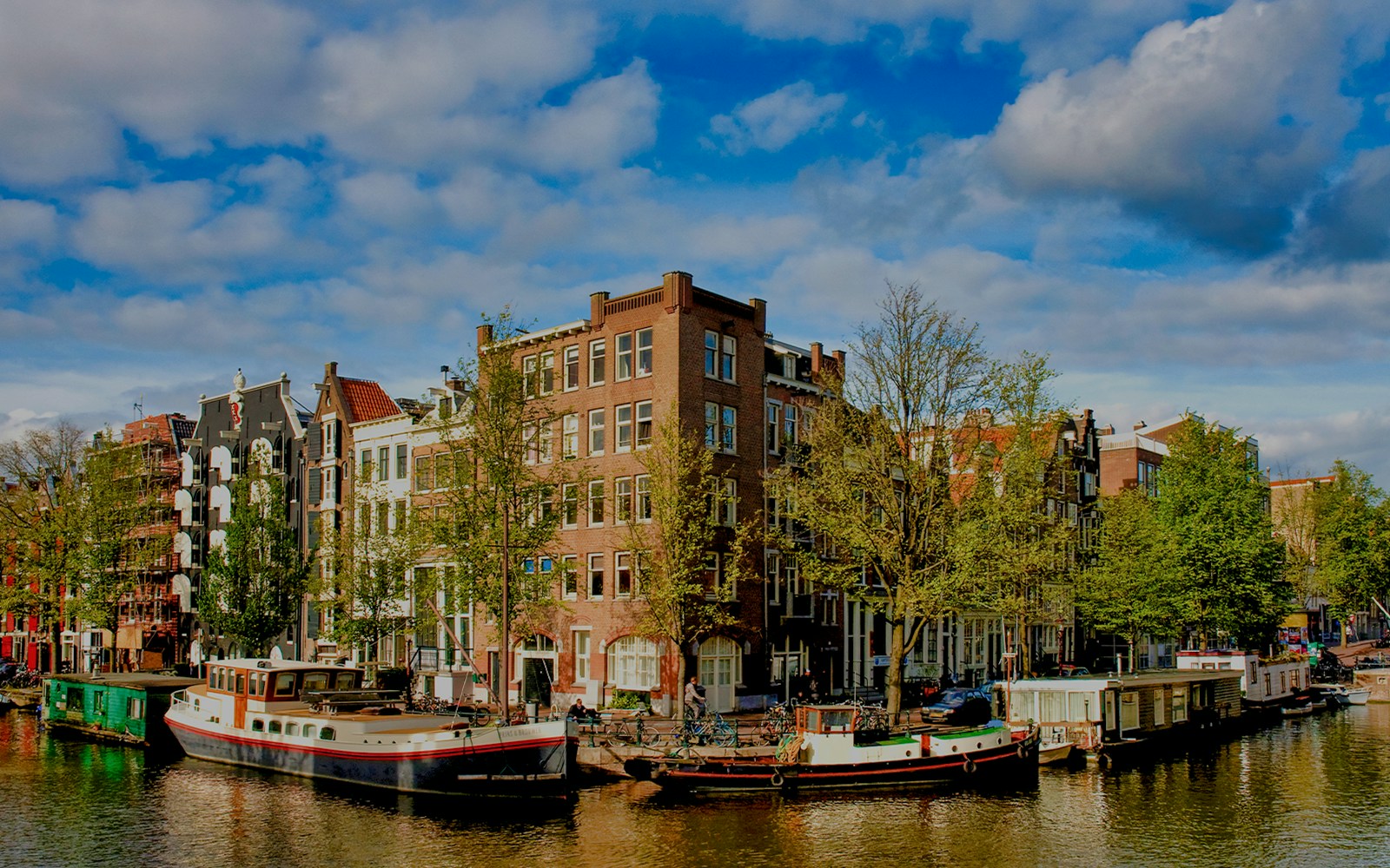 Brouwersgracht canal with historic buildings and houseboats in Amsterdam.