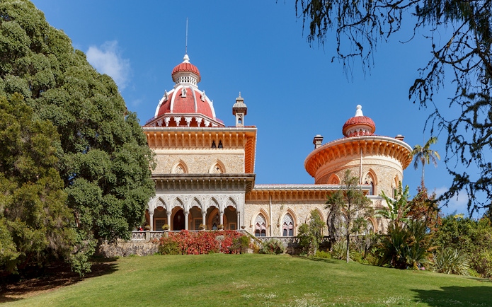Monserrate Palace in Sintra, Portugal, with its distinctive red domes and lush gardens.