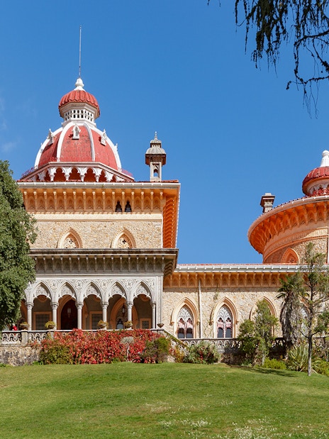 Monserrate Palace in Sintra, Portugal, with its distinctive red domes and lush gardens.