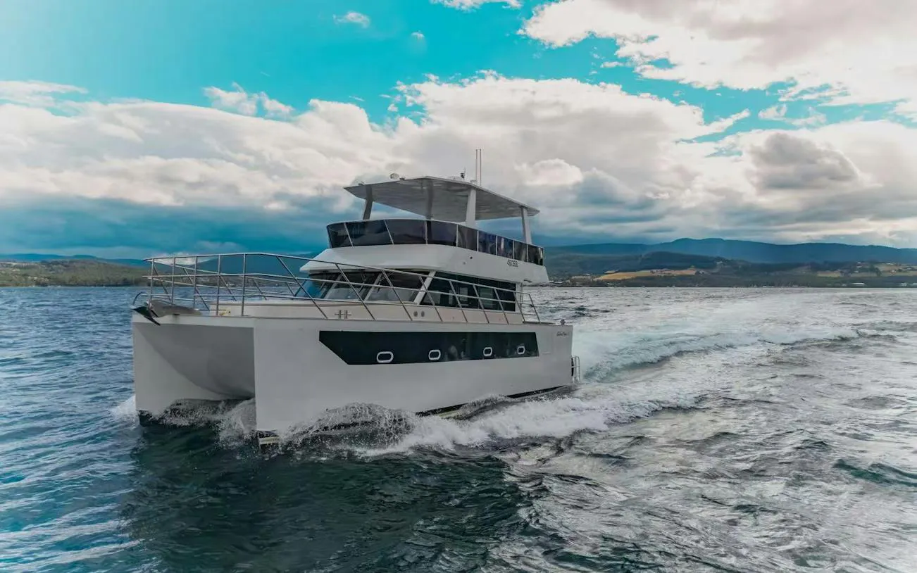 Cruise boat on Hobart waters during sightseeing and fishing tour.