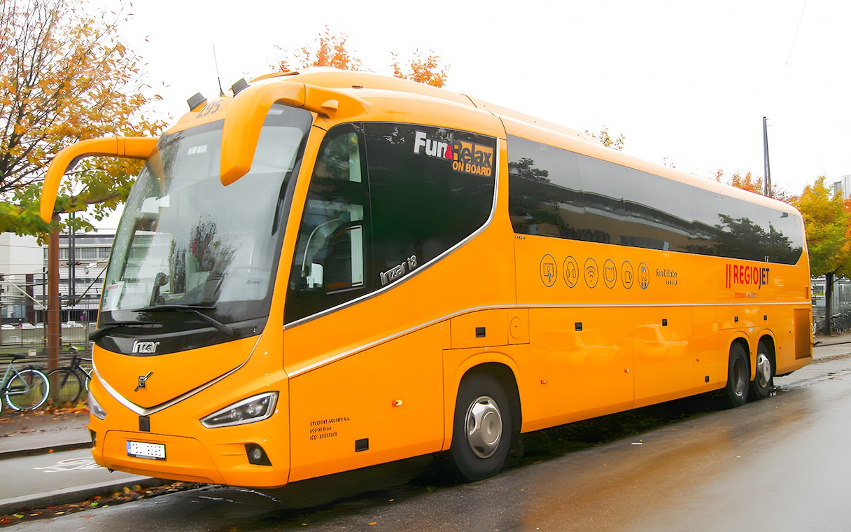 RegioJet bus parked on a street in Prague.