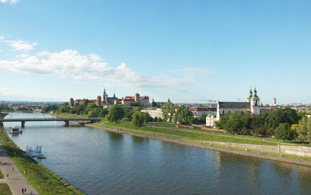 Vistula River with Wawel Castle in Krakow, Poland, seen from a cruise perspective.