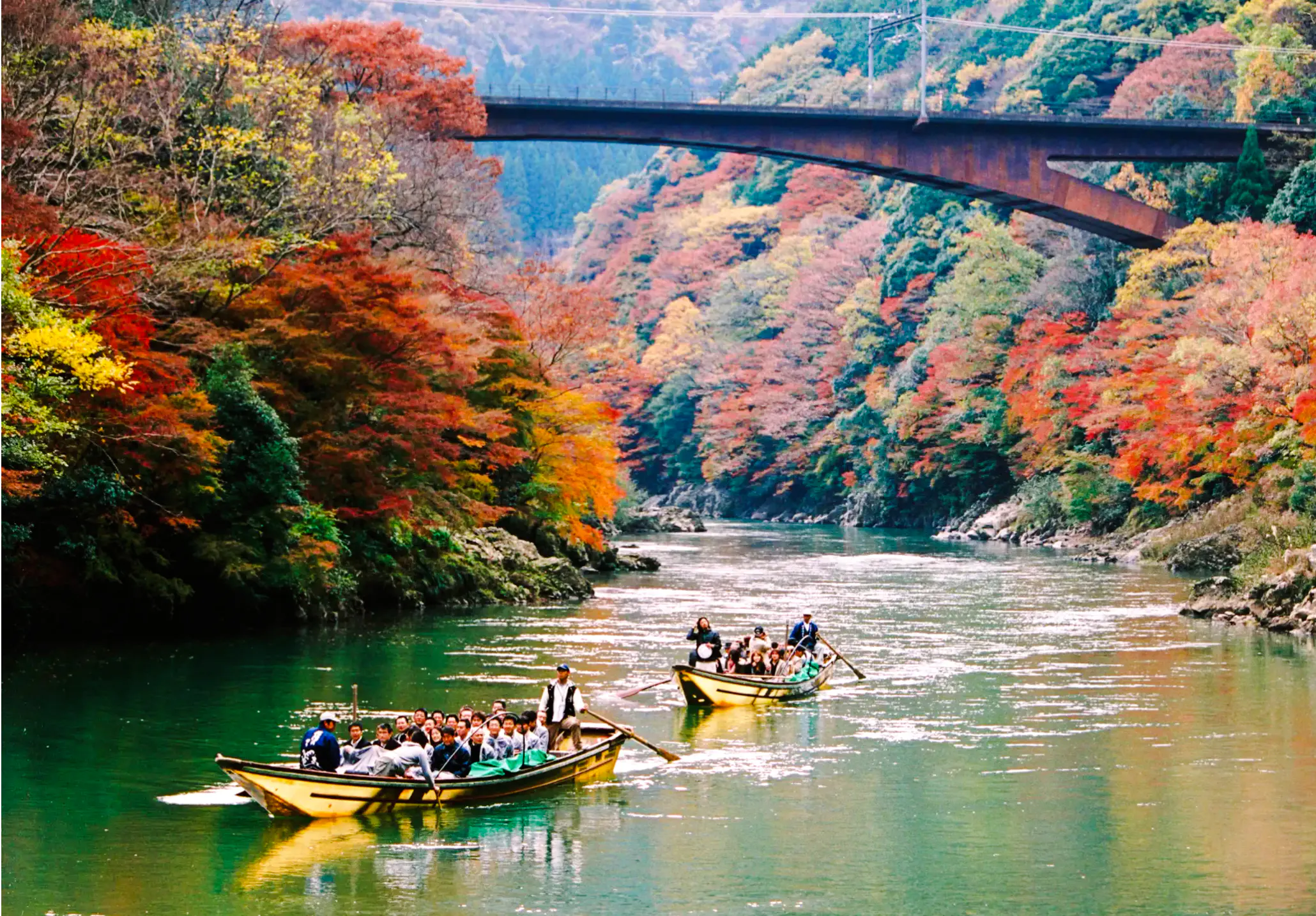 Boat tour on Hozugawa River with autumn foliage, Arashiyama, Kyoto.
