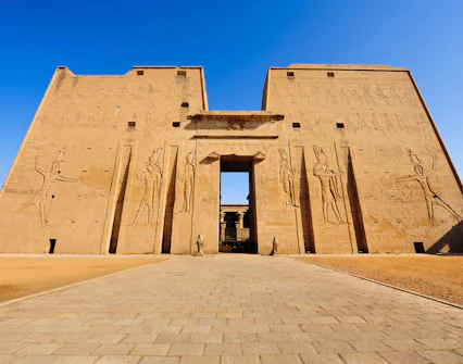 Edfu Temple entrance with ancient Egyptian carvings, Egypt.