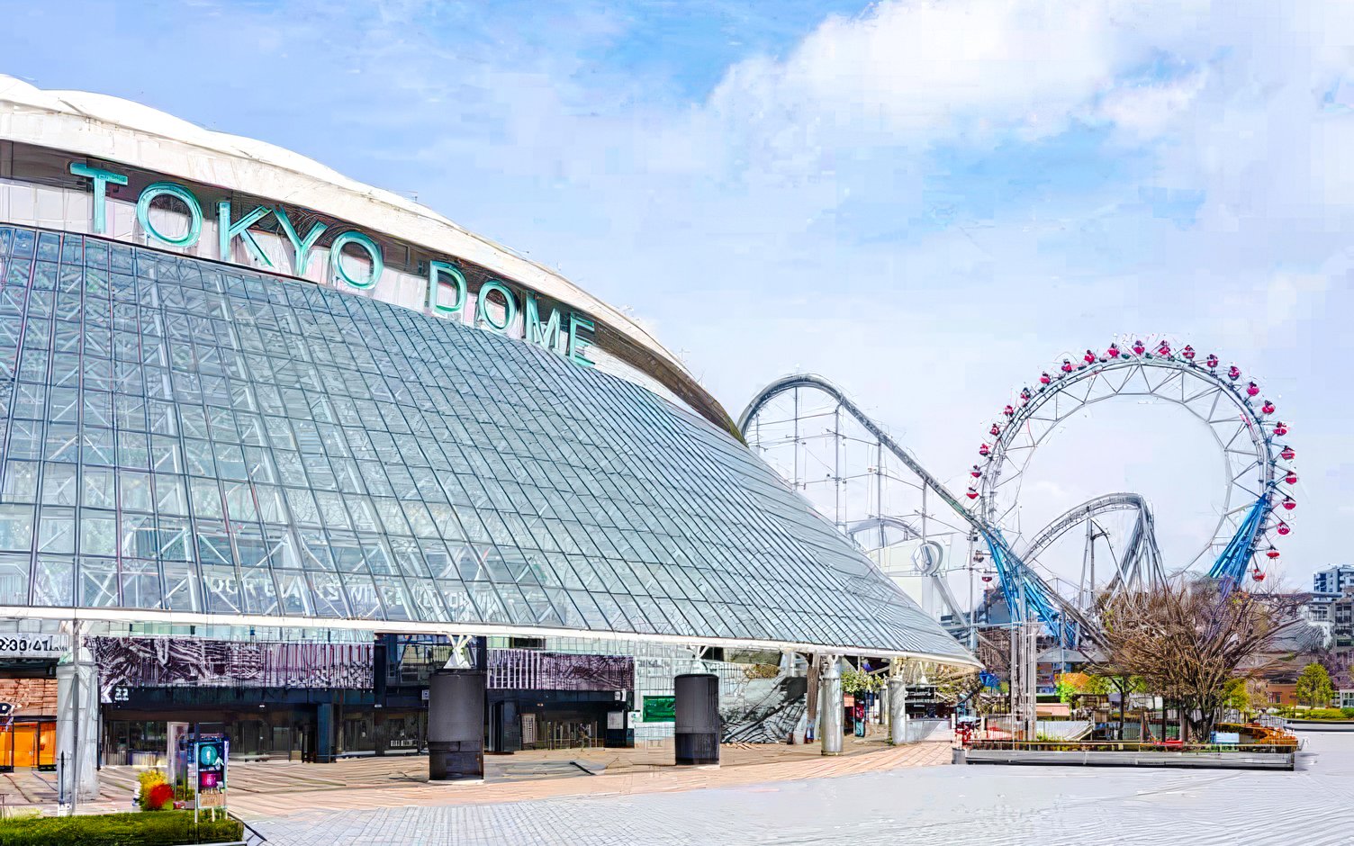 Tokyo Dome entrance with ferris wheel in the background, Tokyo, Japan.