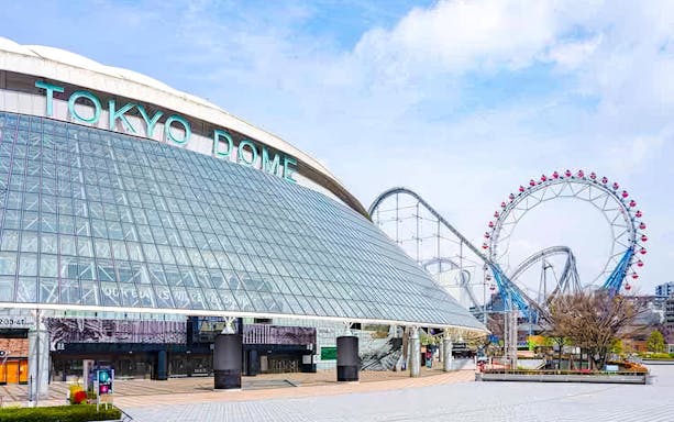 Tokyo Dome entrance with ferris wheel in the background, Tokyo, Japan.