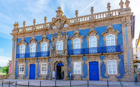 Baroque-style palace with blue azulejos in Braga, Portugal, part of Roman heritage exploration game.