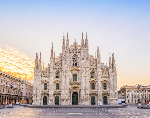 Duomo di Milano facade with intricate Gothic architecture in Milan, Italy.