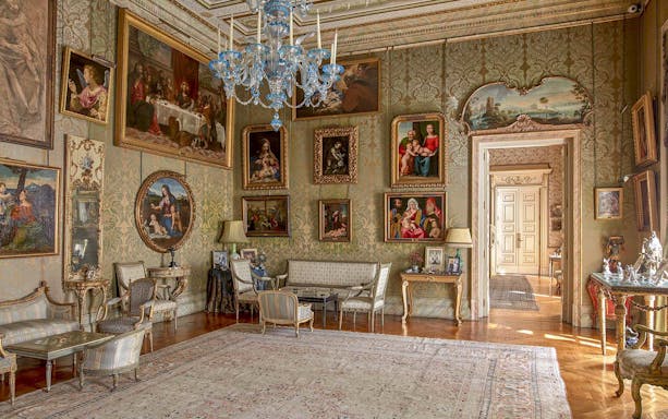 Liria Palace interior with ornate paintings and elegant furniture in a richly decorated room.