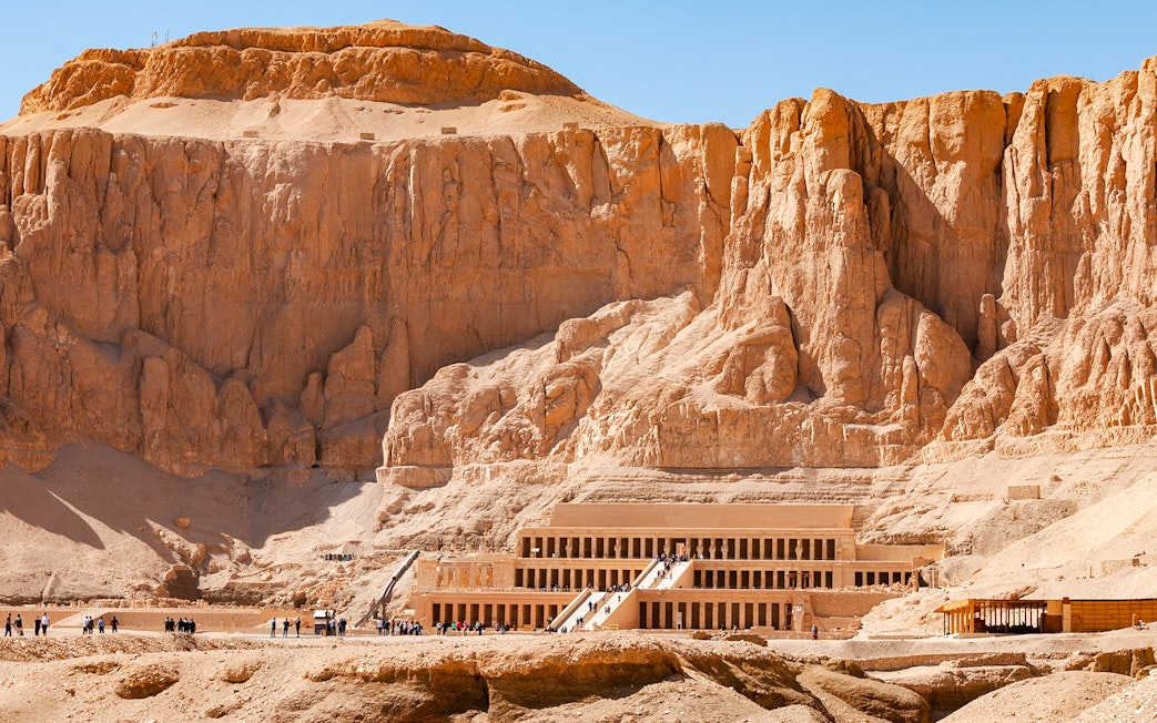 Hatshepsut Temple in Luxor's Valley of the Kings with tourists exploring.